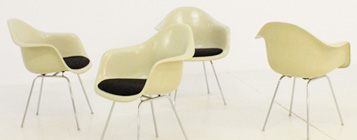 FOUR EAMES FIBERGLASS ARMCHAIRS